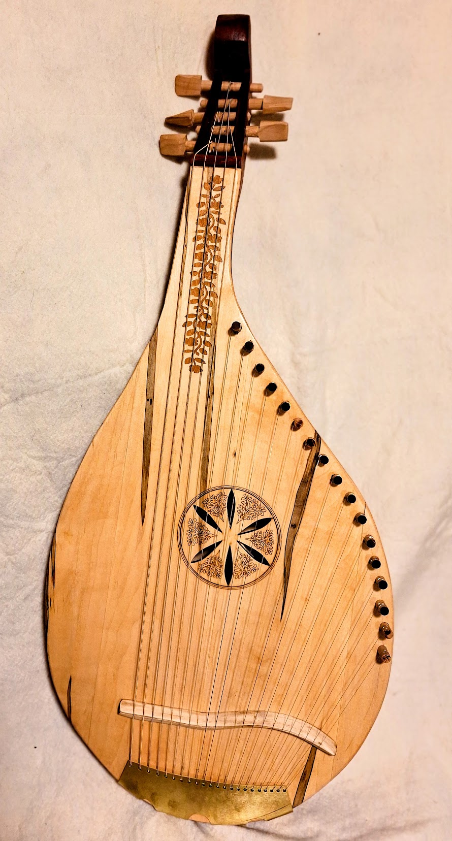 Latest finished handmade folk bandura with decorative rosette and light wood body